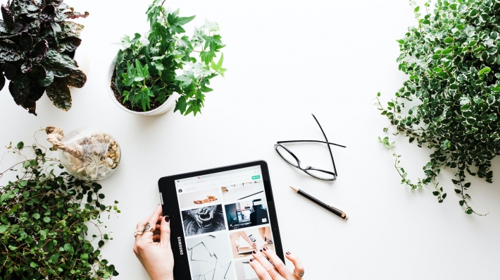 A consumer online surrounded by plants 