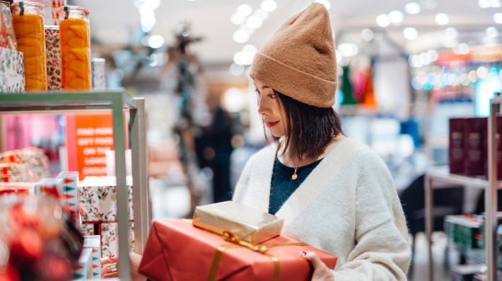 Woman holds gift boxes