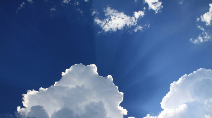 Clouds against a clear blue sky